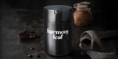 Black metallic coffee container storing roasted coffee beans on